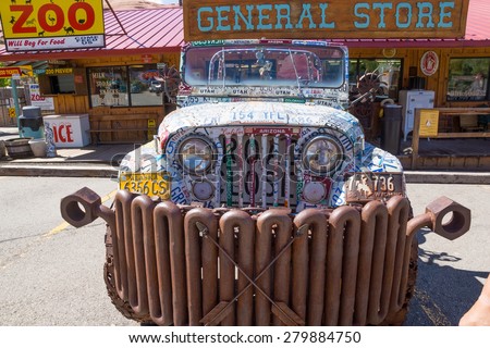 Moab,  Utah/US - MAY 17,2015; Front view of a car decorated american license marks the various states and different scrap