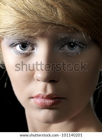 Pretty model portrait, full face, black background