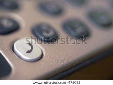 mobile phone keypad, with shallow depth of focus to emphasize the phone symbol