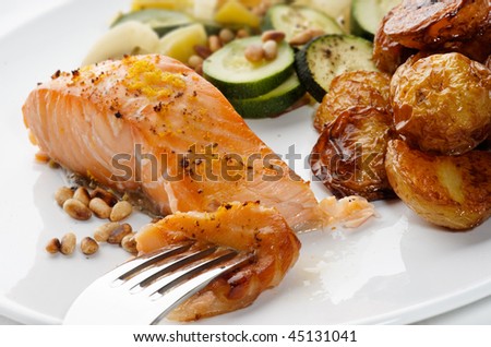 Salmon Fillet with Pine nuts, courgettes and roasted new potatoes