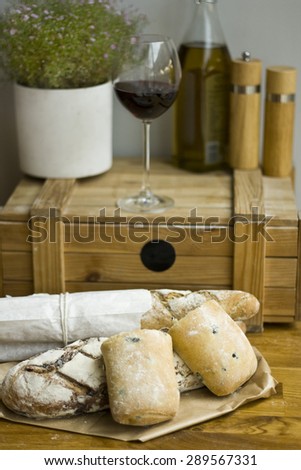 Fresh baked rustic bread loaves on paper bags
