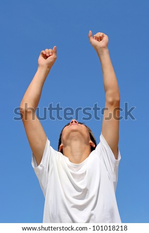 happy person jumping on blue sky background