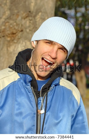 man with open mouth stand on the street
