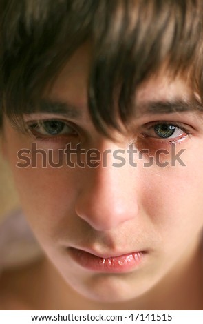 sad teenager portrait close up with focus on eye