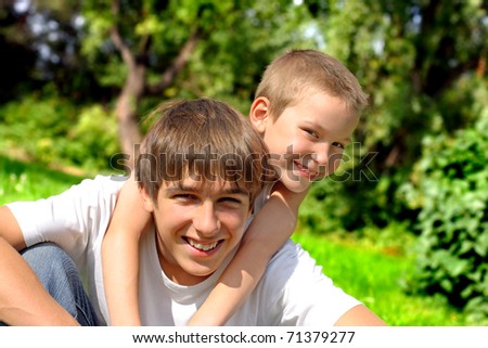 happy brothers in the summer park