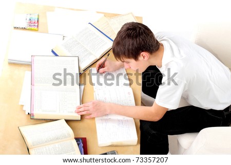A teenager studying hard for the exam