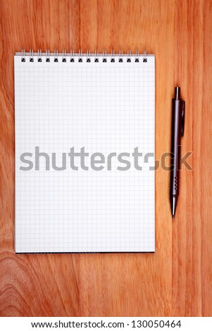 Blank Writing Pad and Pen On The Table