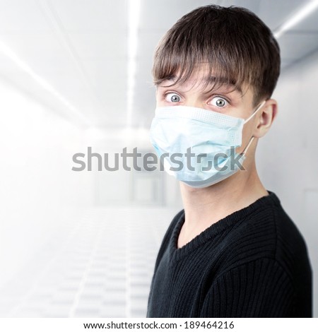 Surprised Teenager in the Flu Mask