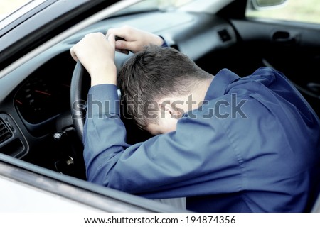 Young Man fall asleep in a Car