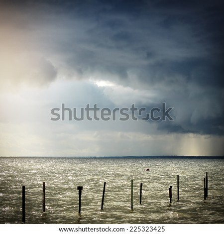 Toned Photo of Seaside Landscape with Thunderstorm Clouds