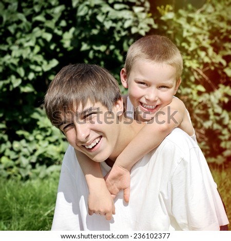 Toned photo of Happy Brothers at the Summer Park
