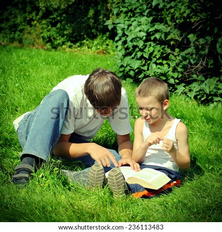 Toned photo of Teenager reads the Book to the Child