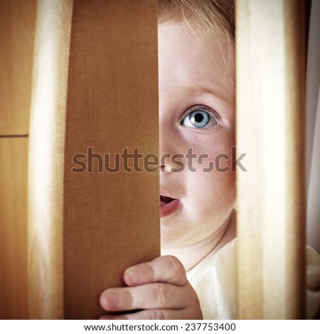 Cheerful Little Baby Playing Hide and Seek