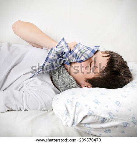 Sick Young Man on the Bed with Handkerchief