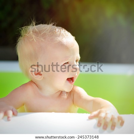 Happy Baby Boy Portrait in the Pool at Sunny Summer Day
