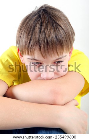 Sad and Tired Teenager on the White Background