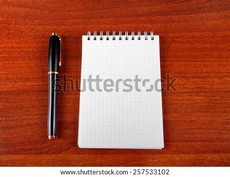 Blank Writing Pad and Pen on The Table