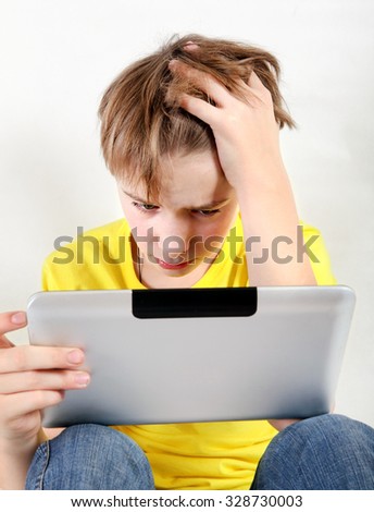 Sad and Stressed Kid with Tablet Computer