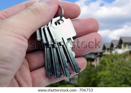 Real Estate agent hands over the keys.
