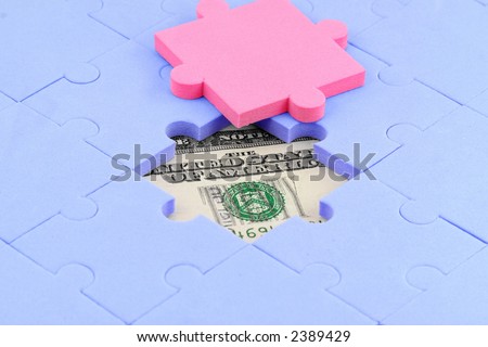 us dollar and puzzles close up, business concept