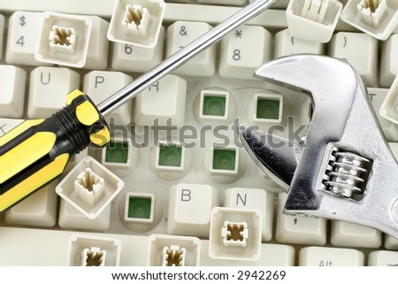 Adjustable Wrench and keyboard, concept of computer repairing