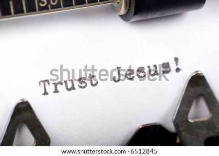 Typewriter close up shot, concept of Trust Jesus