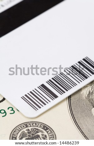 Plastic Digital Data Card and dollar close up