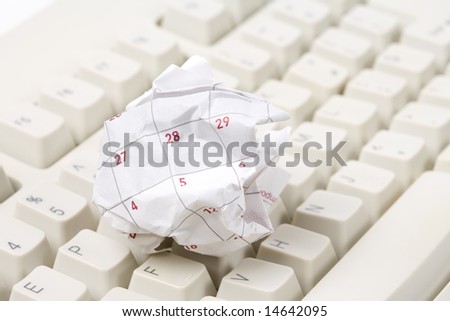 Calendar paper ball and computer mouse, concept of time planning, Wasting Time, Unorganized