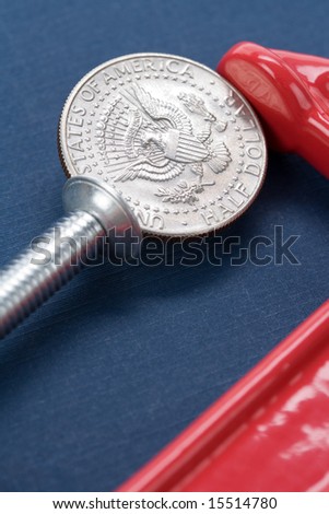 Vise Grip and coin close up