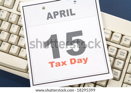 Tax Day, calendar date April 15 and keyboard for background