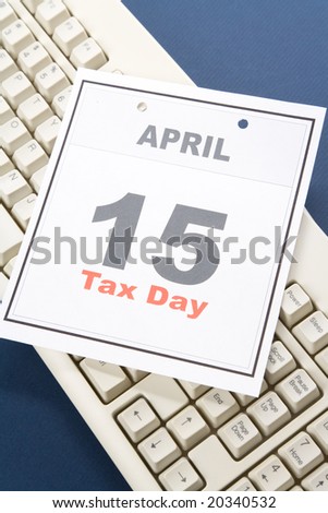 Tax Day, calendar date April 15 and keyboard for background