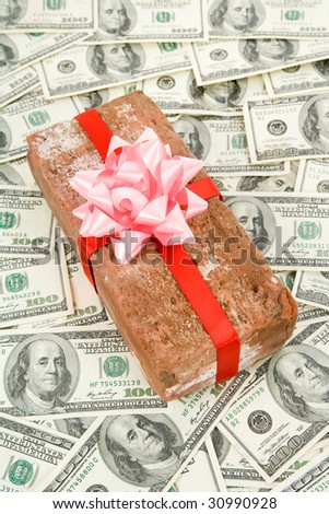 Red Brick Gift and dollars, Concept of joke, make fun of somebody, gift on April Fool\'s Day, Prank gift