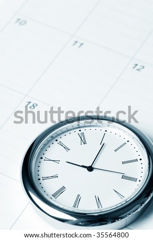 calendar and clock close up shot