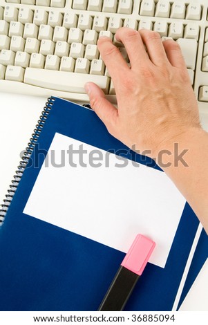 Blue school textbook and computer keyboard, online learning