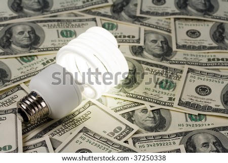 Compact Fluorescent Lightbulb and dollar clsoe up