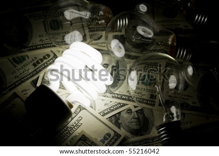 Compact Fluorescent Light bulb and dollar clsoe up