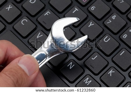 Computer Keyboard and Wrench, concept of IT Support