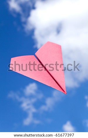 Red Paper Airplane and blue sky