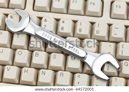 Computer Keyboard and Wrench, concept of IT Support