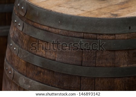 Close-up of a wood wine barrel. Wood slats and Iron work.
