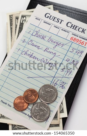 Guest Check and dollar, concept of restaurant expense.
