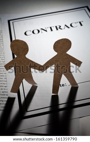 Contract and Paper Chain Men close up