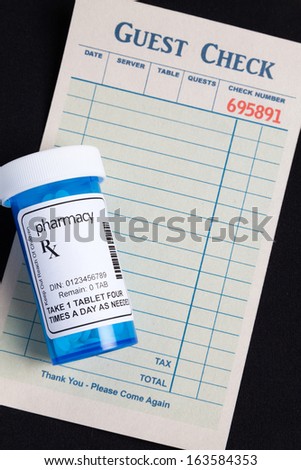 Guest Check and Pill Bottle, concept of avoid Food and Drug Interactions.