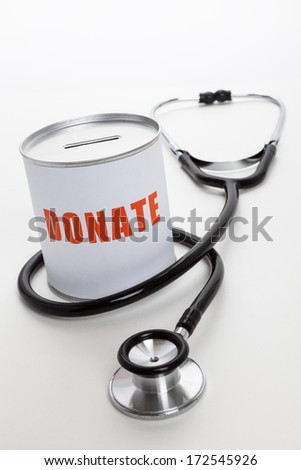 Stethoscope and Donation box, concept of Charity work.