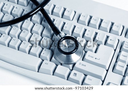 Stethoscope and Computer Keyboard, concept of Healthcare And Medicine