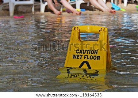 Caution wet floor sign dipped in water