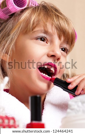 Portrait of pretty little girl with makeup