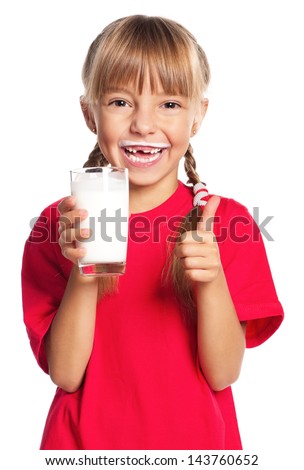 Beautiful smiling little girl with a glass of milk isolated on white background