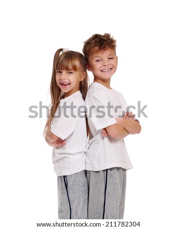 Happy boy and little girl standing back to back isolated on white background