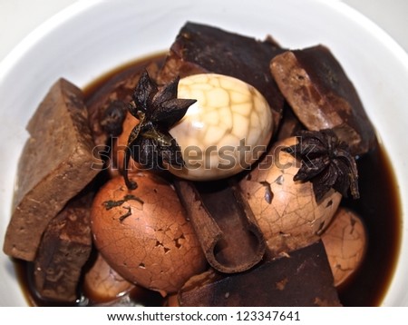 Tea egg is a Chinese savory food commonly sold as a snack. The recipe uses star anise, cloves, Chinese cinnamon, Sichuan pepper, fennel seeds, soy sauce, black tea leaves, dry tofu and chicken eggs.
